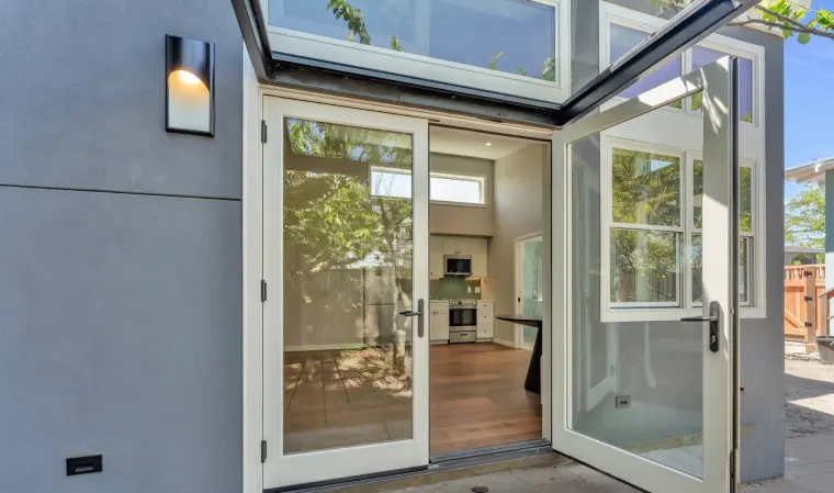French doors thrown open onto the living area