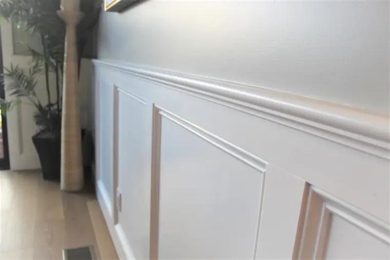 Close view of the white wainscoting panels