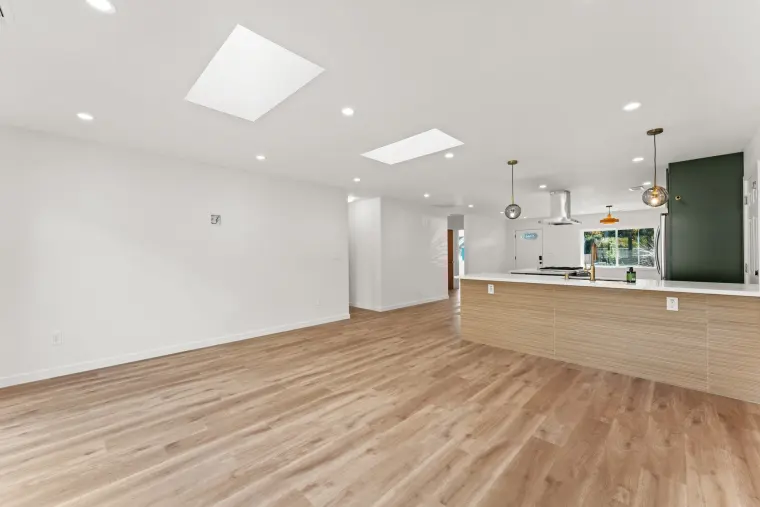 Living area with two skylights looking toward the kitchen island
